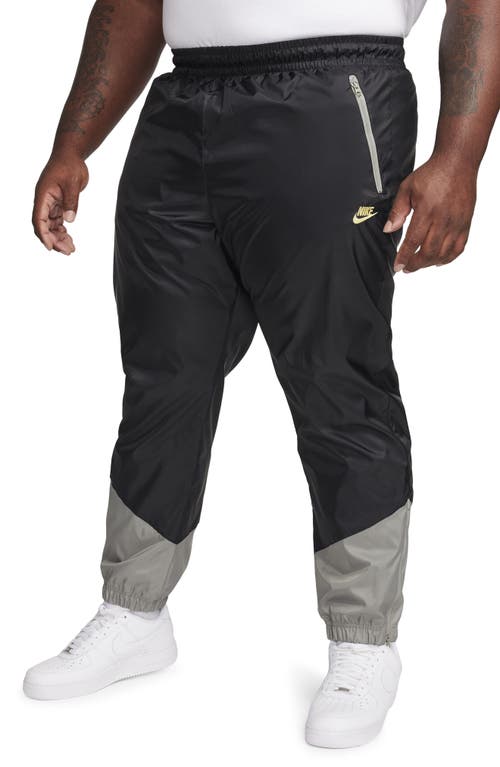 Nike Windrunner Woven Lined Pants in Black/Dark Stucco/Saturn at Nordstrom, Size X-Large