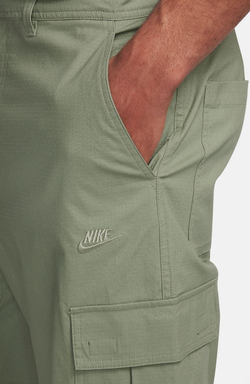 Shop Nike Club Stretch Cotton Cargo Pants In Oil Green/oil Green