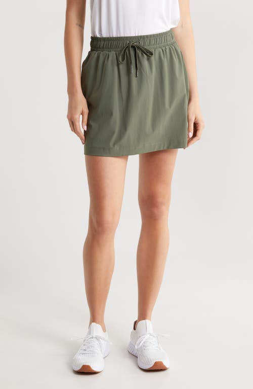 Shop Sweaty Betty Explorer Miniskirt In Ivy Green