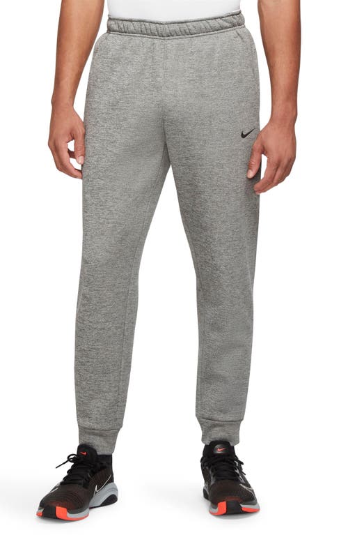 Shop Nike Therma-fit Tapered Training Pants In Dk Grey/particle Grey/black