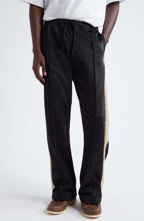 STOCKHOLM SURFBOARD CLUB Monogram Track Pants in Black 