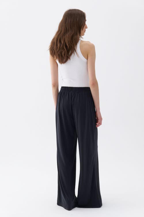 Shop Nocturne Loose Fit Wide Leg Pants In Black