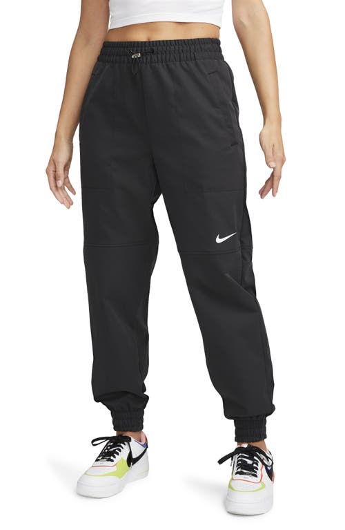 Nike Sportswear Water Repellent Swoosh Pants In Black/white