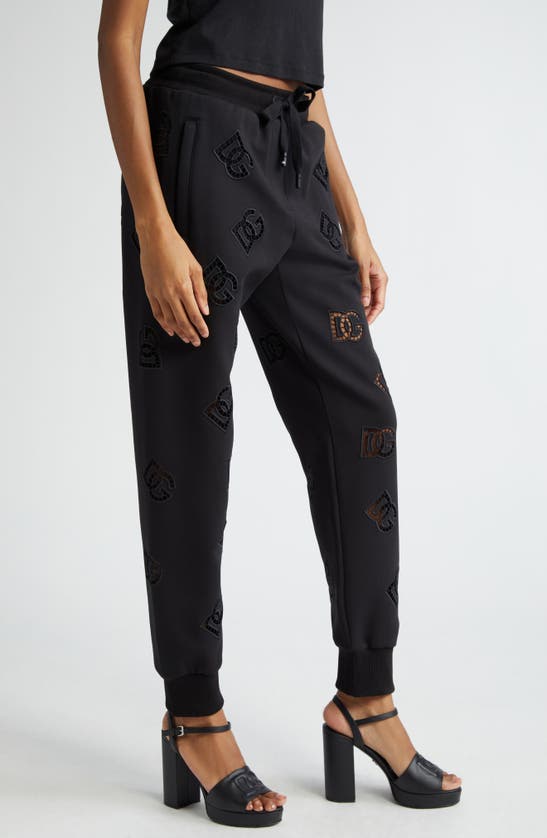 Dolce & Gabbana Eyelet Logo Cotton Blend Joggers In N0000nero