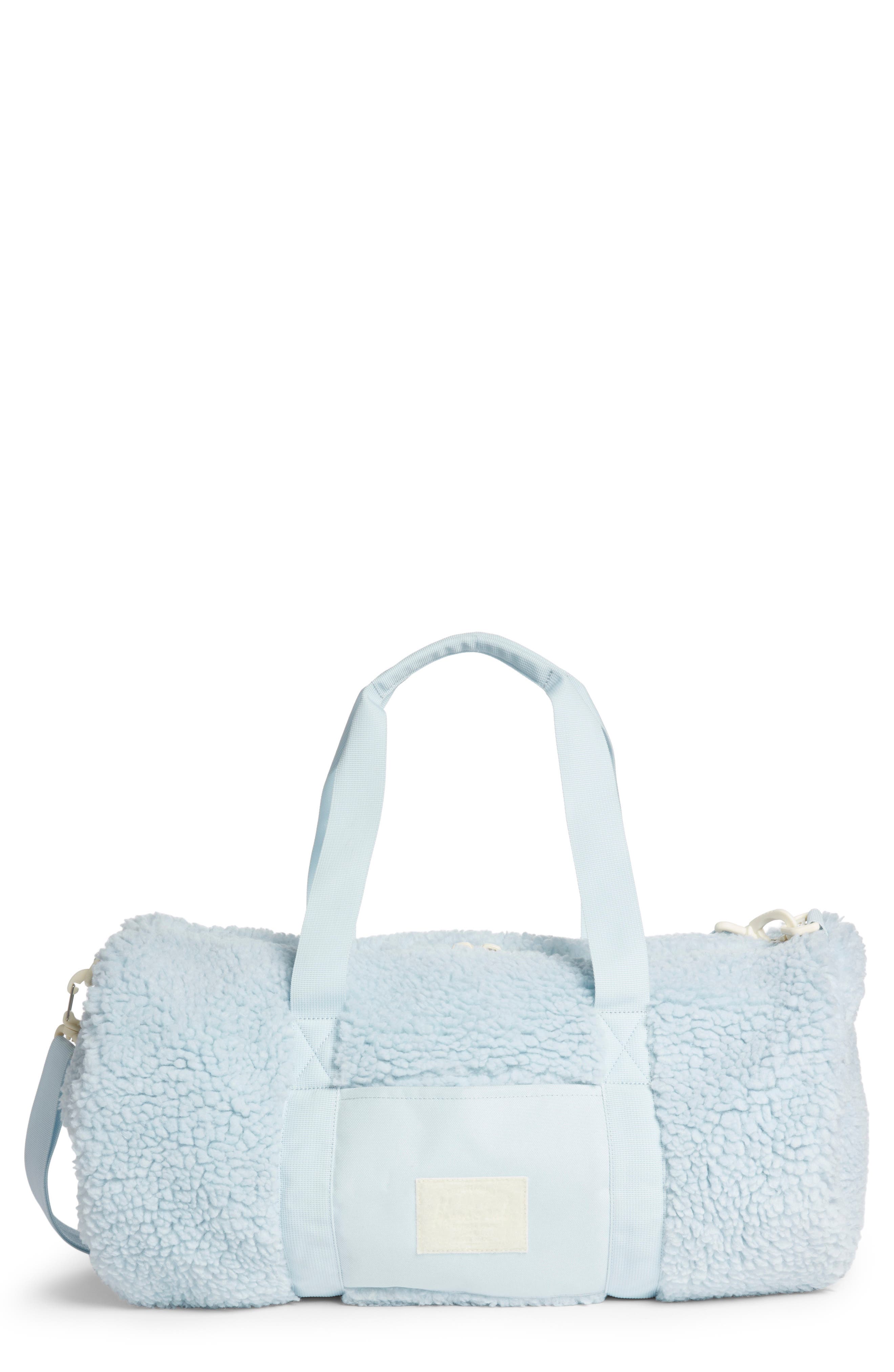 light blue duffle bag