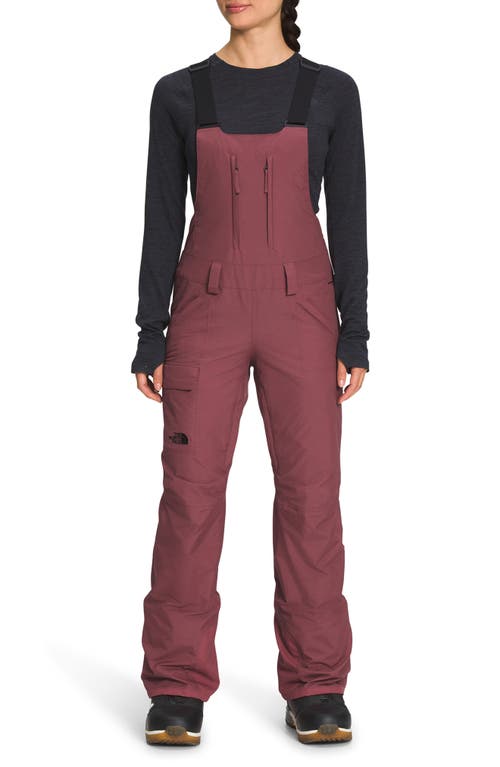 The North Face Freedom Waterproof Snow Bib Overalls in Wild Ginger