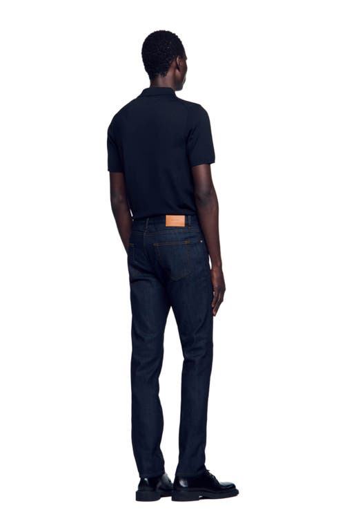 Shop Sandro Waterless Narrow Cut Jeans In Raw-denim