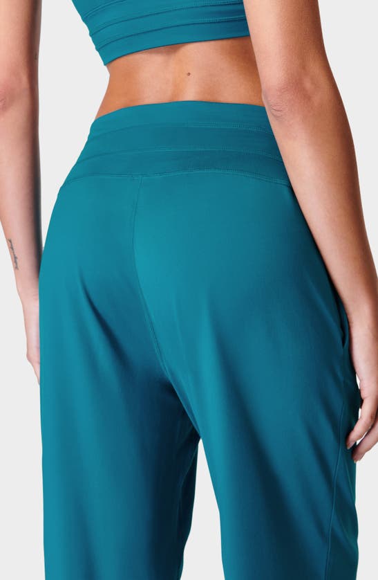 Shop Sweaty Betty Gaia Pocket Joggers In Reef Teal Blue