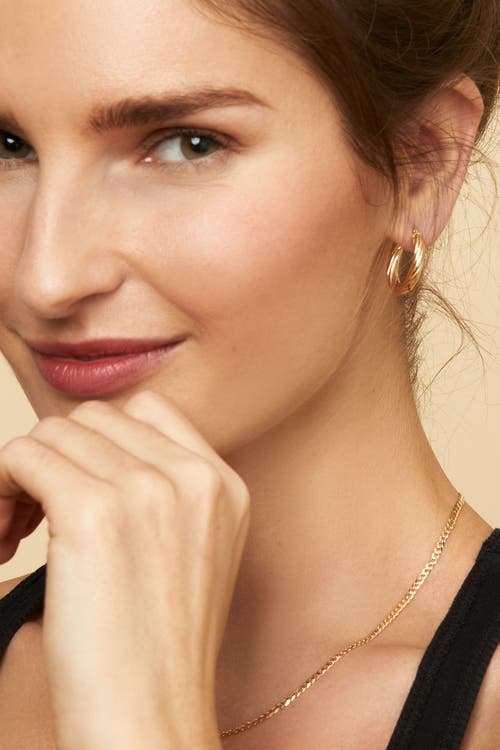 Oradina 10k Gold With A Twist Oval Hoops Earrings In Yellow Gold