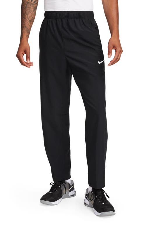 Shop Nike Form Dri-fit Versatile Pants In Black/silver
