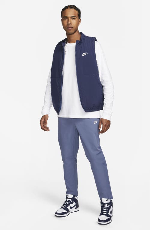 Shop Nike Woven Tapered Leg Pants In Diffused Blue/white