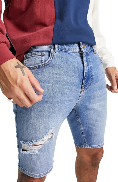ASOS DESIGN Distressed Skinny Denim Shorts in Medium Blue