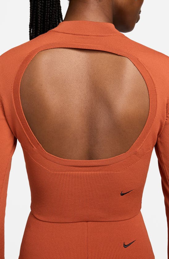 Shop Nike Open Back Crop Sweater In Burnt Sunrise/ Black