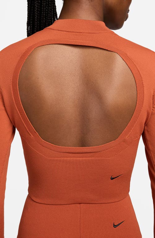 Shop Nike Open Back Crop Sweater In Burnt Sunrise/black