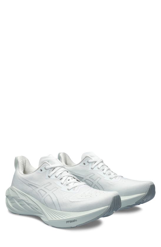 Shop Asics Novablast 4 Running Shoe In White/ Pale Mint