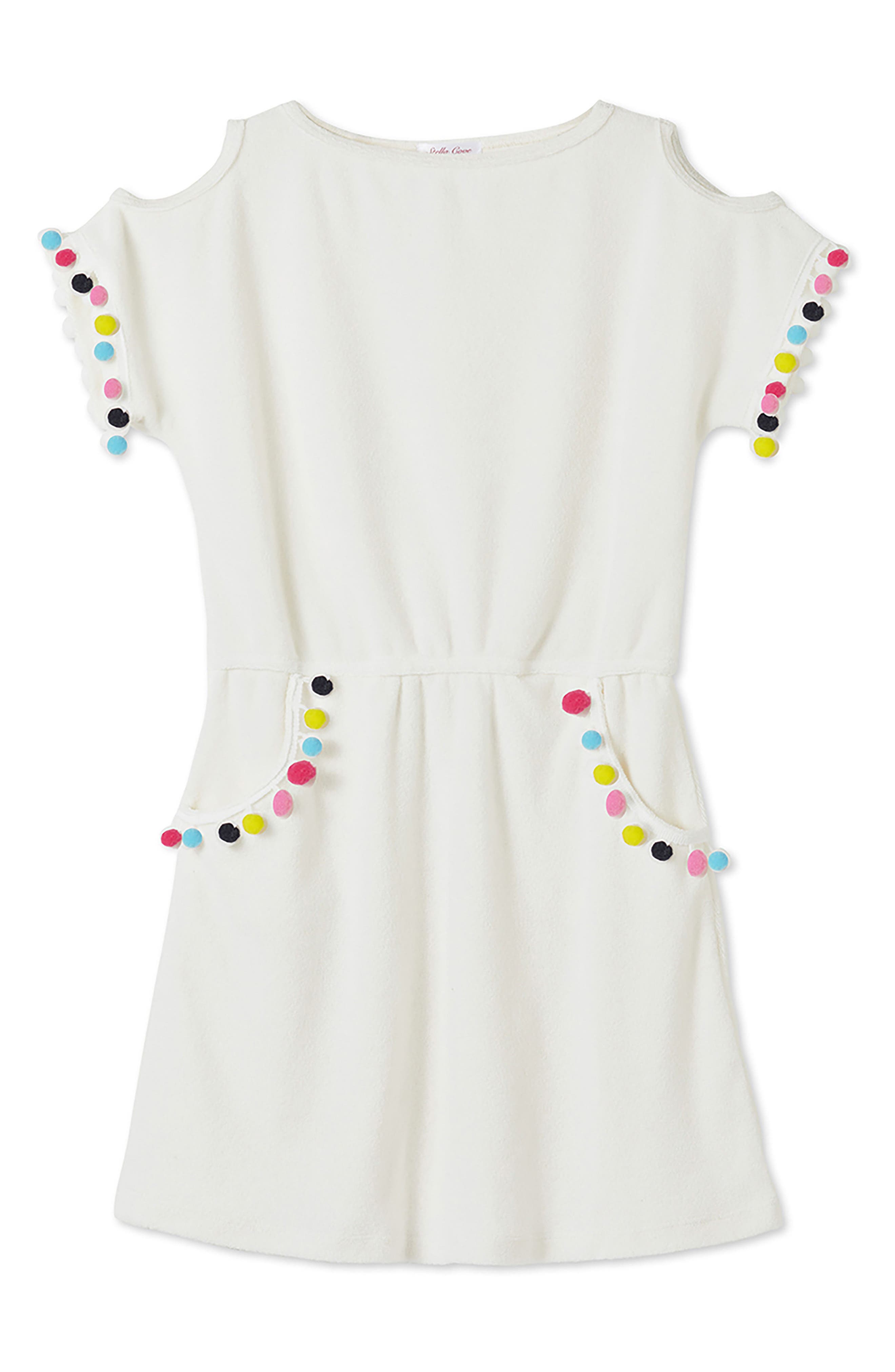 white dress with colorful pom poms