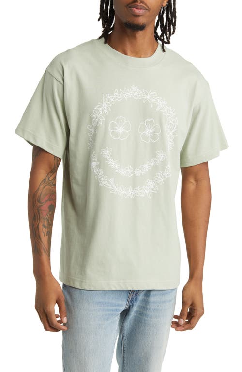 ALPHA COLLECTIVE Smiley Flower Graphic T-Shirt in Desert Sage