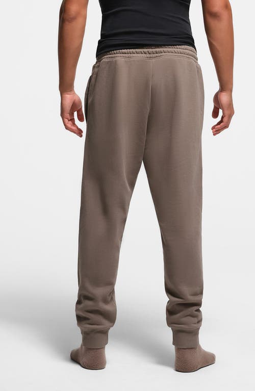 Shop Skims Tapered Fit Cotton Blend Joggers In Truffle