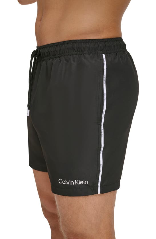Shop Calvin Klein Modern Euro Logo Piping Swim Trunks In Black