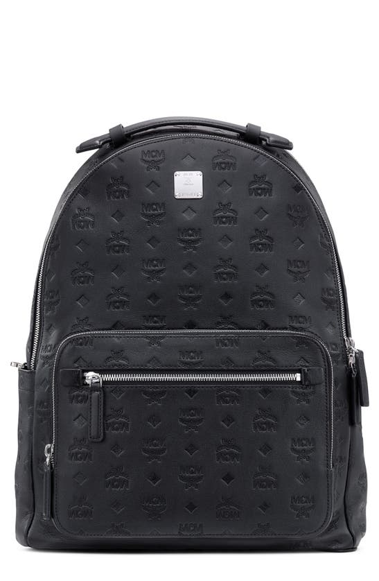 Mcm Stark Monogram Embossed Leather Backpack In Black