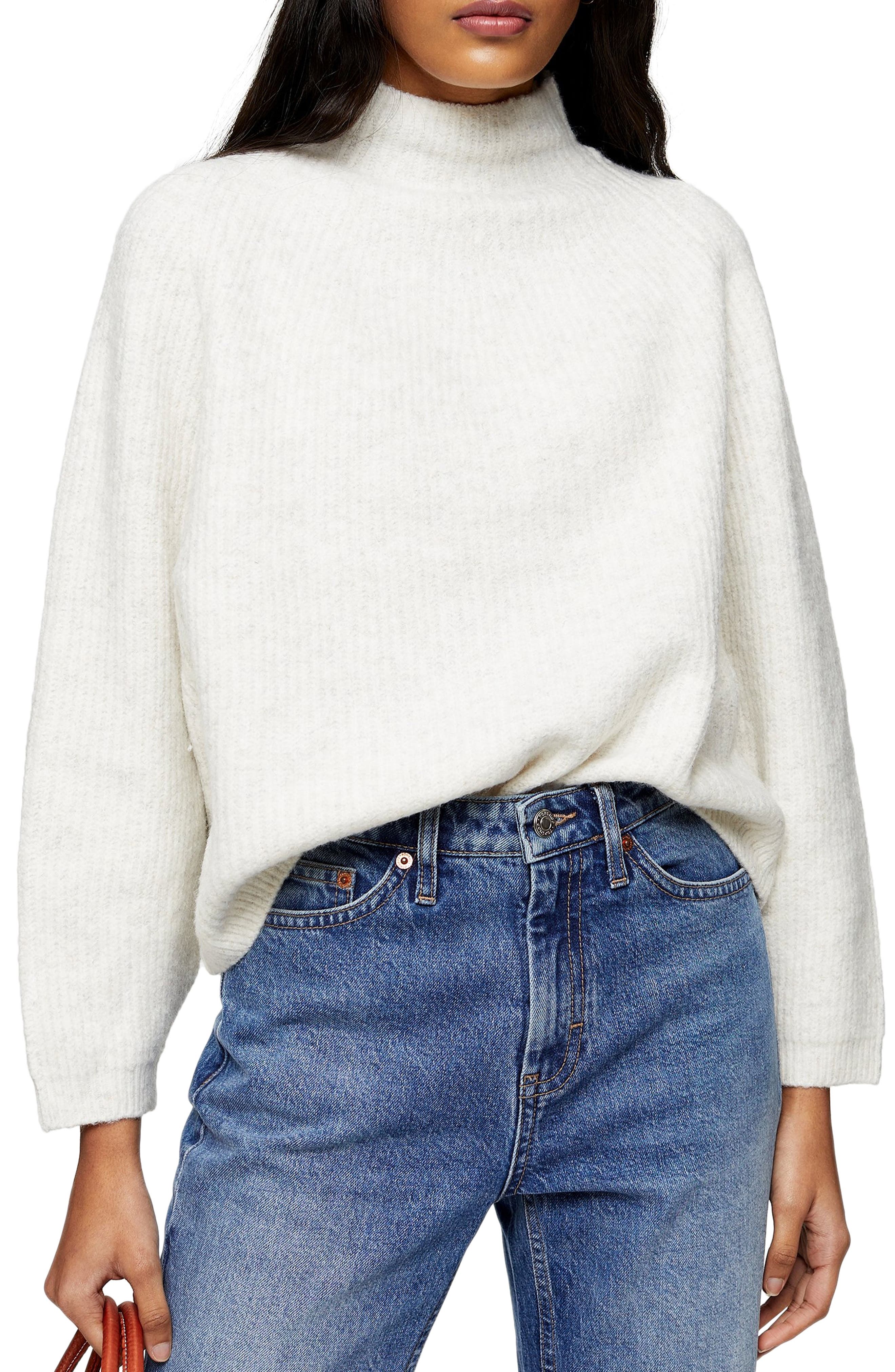 white funnel neck sweater