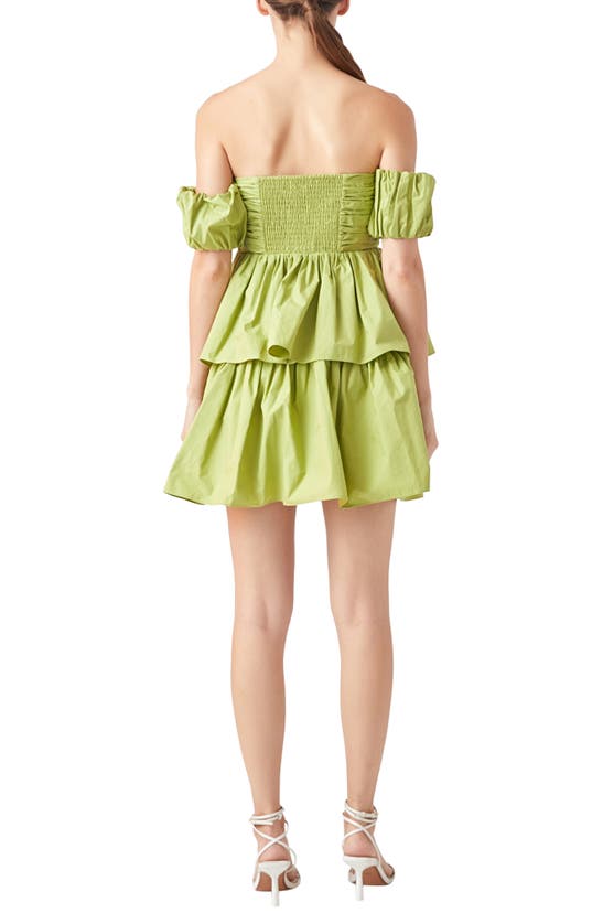 Shop Endless Rose Ruched Tiered Off The Shoulder Minidress In Pistachio