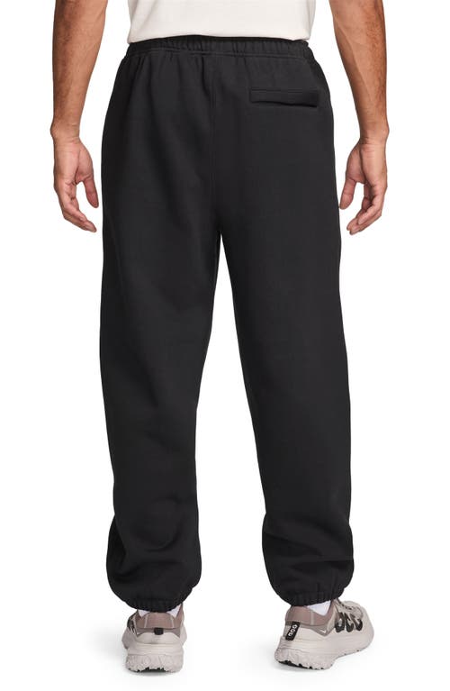 Shop Nike Acg Lungs Therma-fit Repel Tuff Fleece Pants In Black/anthracite/white