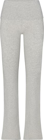 SKIMS wearing a size small in light heather grey folded pants and shi, skims  fold over pant