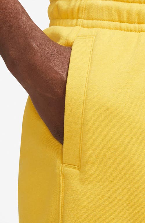 Shop Nike Revival Fleece Shorts In Vivid Sulfur/white