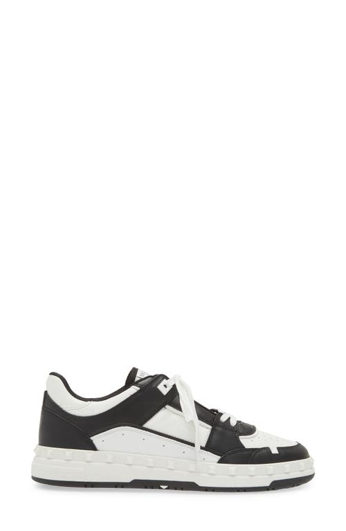 Shop Valentino Garavani Rockstud Low Top Sneaker In Bianco/nero