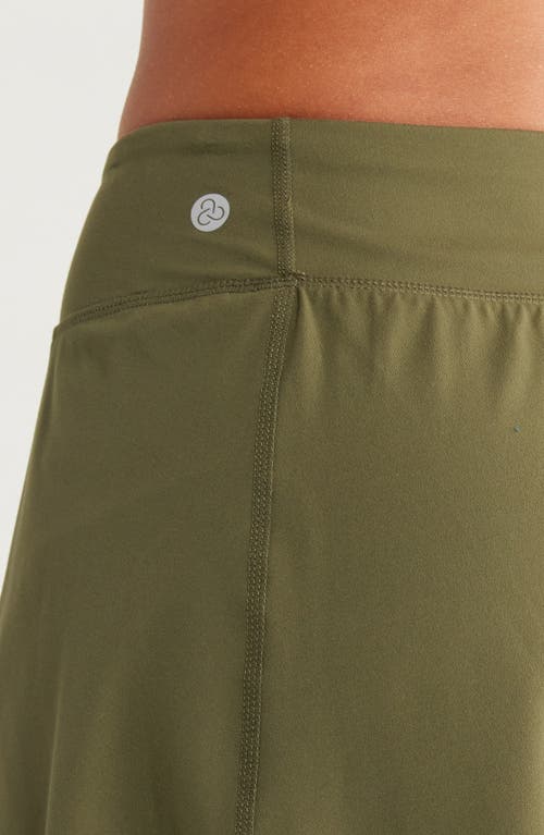 Shop Zella Luxe Lite Step Out Tennis Skirt With Shorts In Olive Night