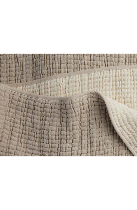 Shop Parachute Organic Cotton Gauze Throw Blanket In Natural And Ivory