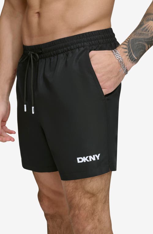 Shop Dkny Core Solid Swim Trunks In Black
