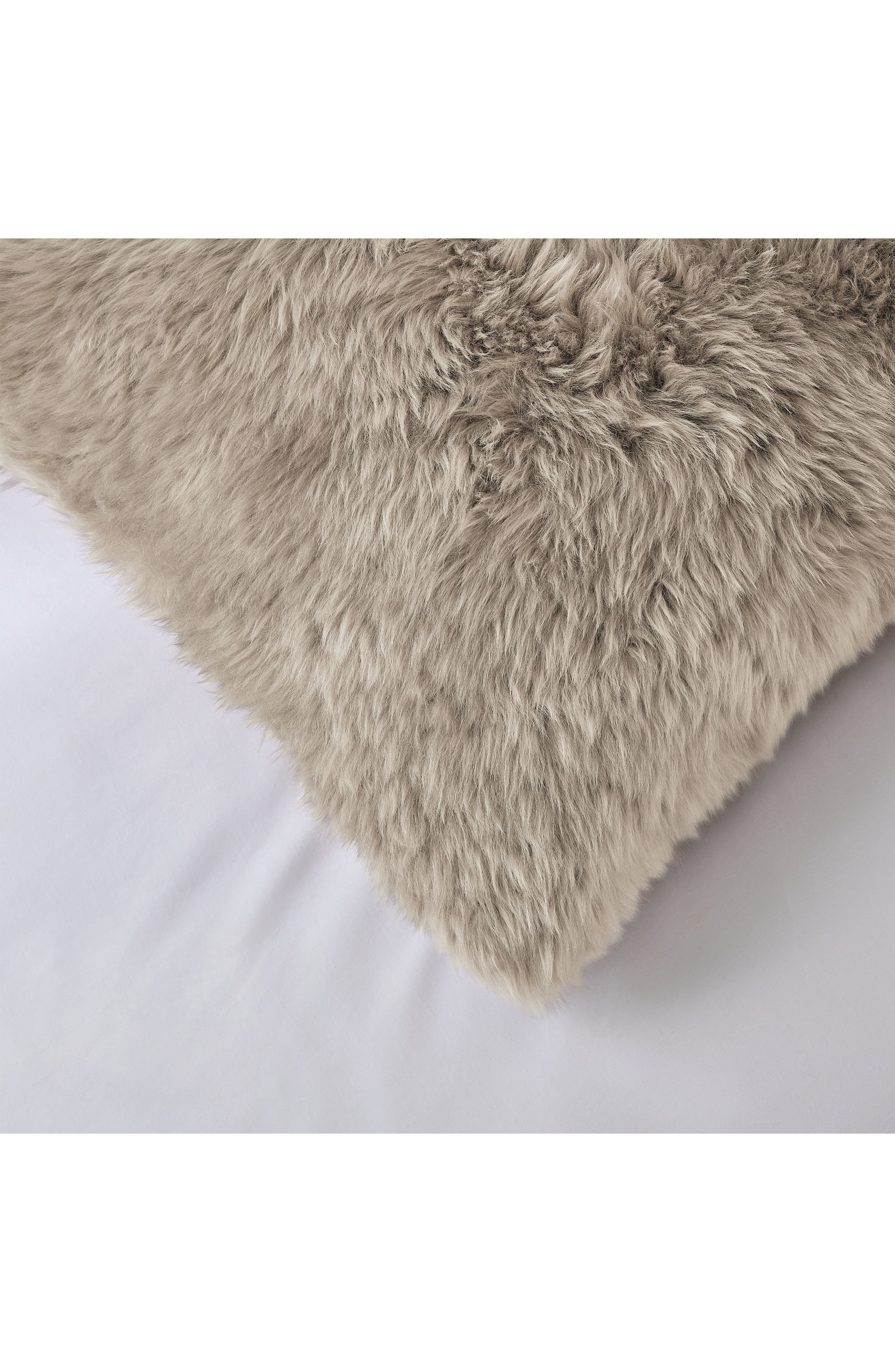 white fur cushion