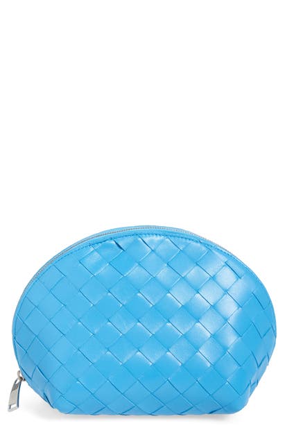 Click to view more detailed imagery on our partner's website Bottega Veneta Large Intrecciato Leather Cosmetics Case In Swimming Pool