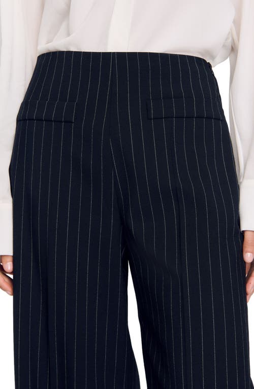 Shop Sandro Chalk-striped Trousers In Black