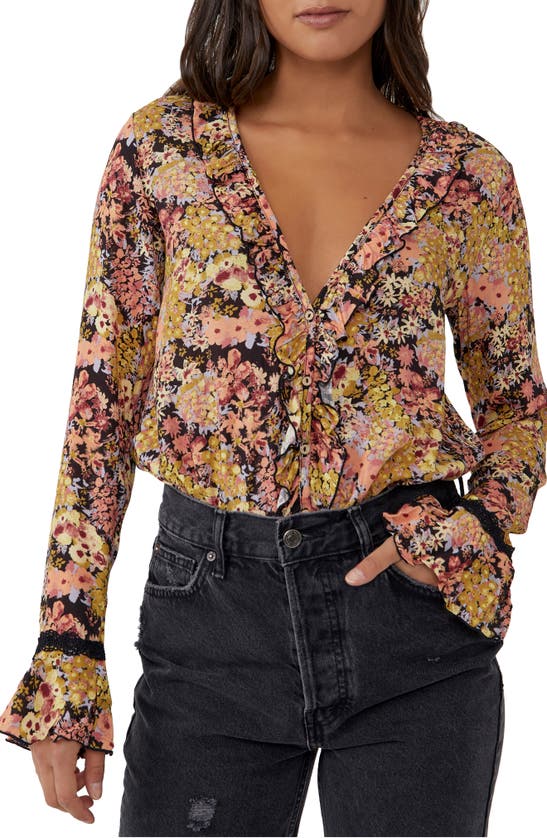 Click to view more detailed imagery on our partner's website Free People Heat Wave Ruffle Long Sleeve Bodysuit In Midnight Combo