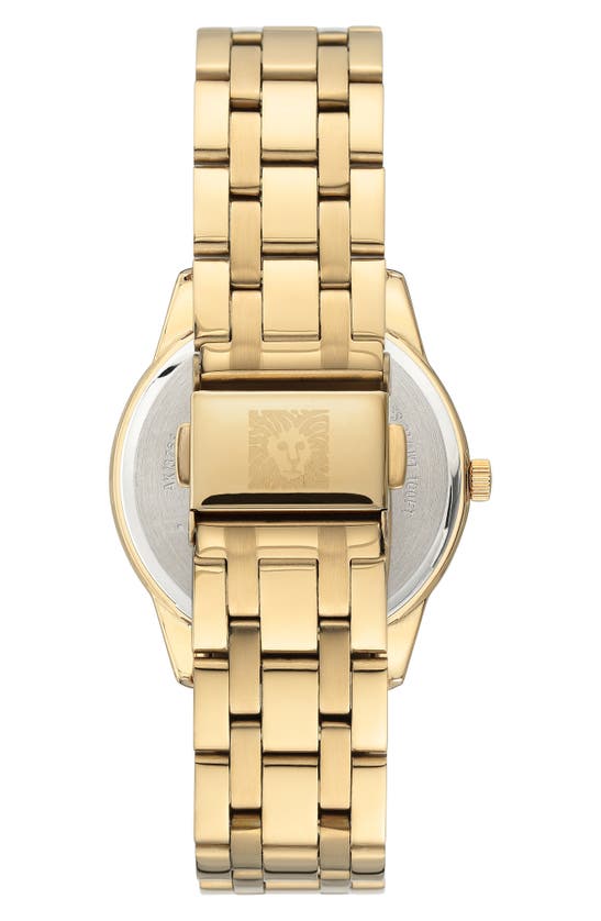 Anne Klein Premium Crystal Accented Solar Powered Bracelet Watch In Black Mother Of Pearl Dial