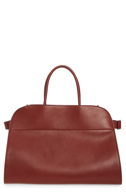 Click to view more detailed imagery on our partner's website The Row Margaux 17 Leather Bag In Dark Berry