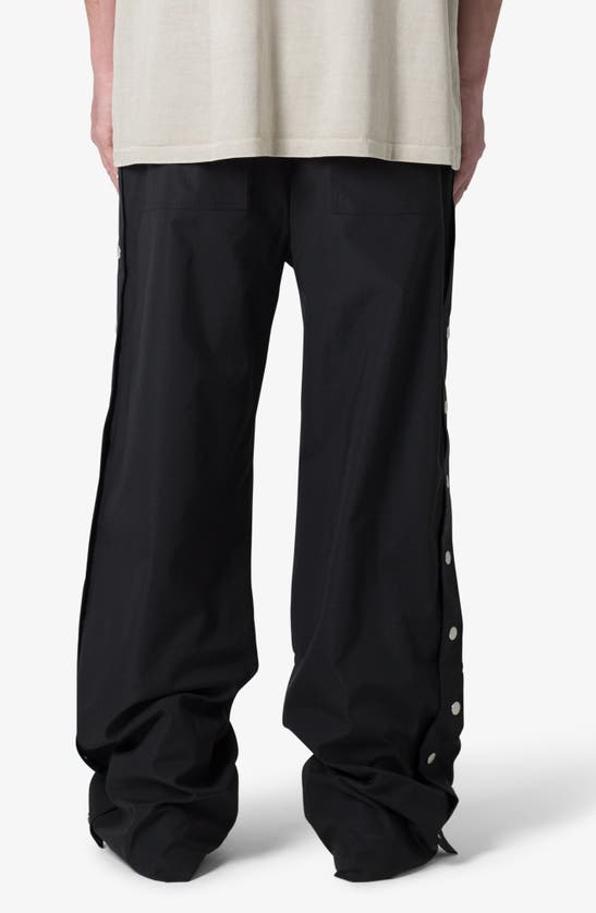 Shop Mnml Oversize Side Snap Nylon Pants In Black