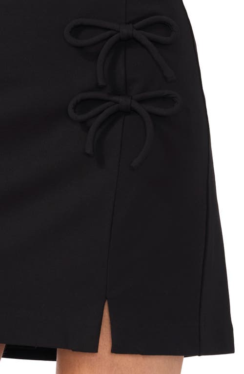 Shop Cece Bow Detail Miniskirt In Rich Black