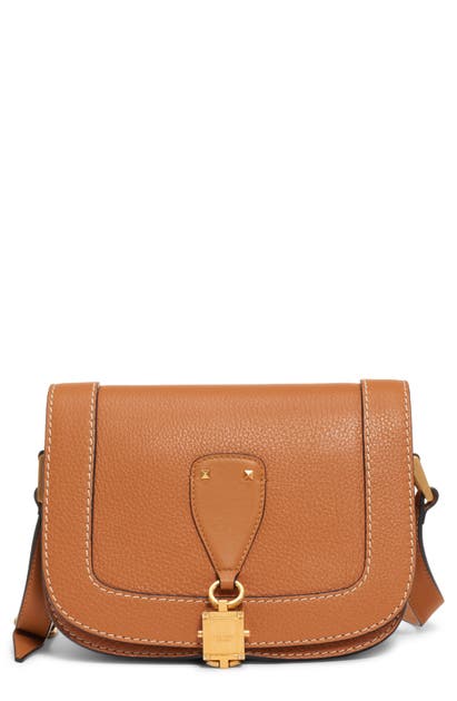Click to view more detailed imagery on our partner's website Valentino Garavani Small V-locker Leather Saddle Bag In Lion