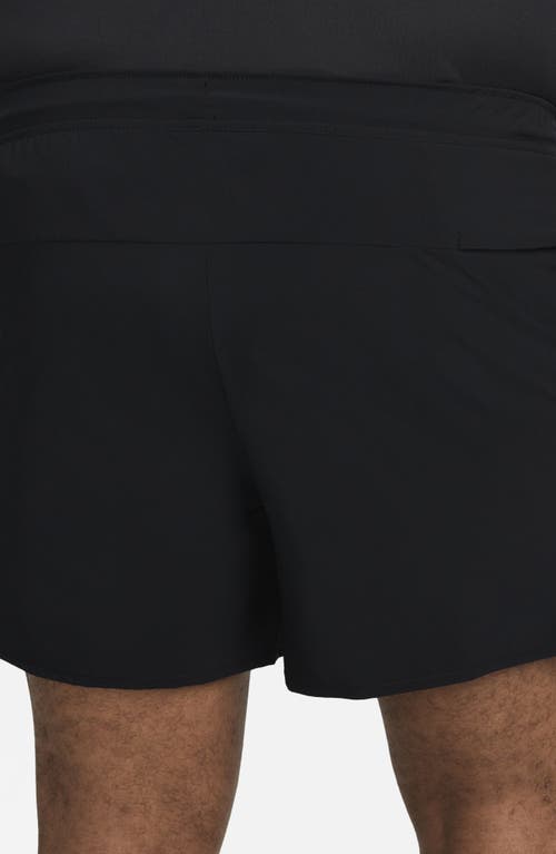 Shop Nike Dri-fit Unlimited 5-inch Athletic Shorts In Black/black/black