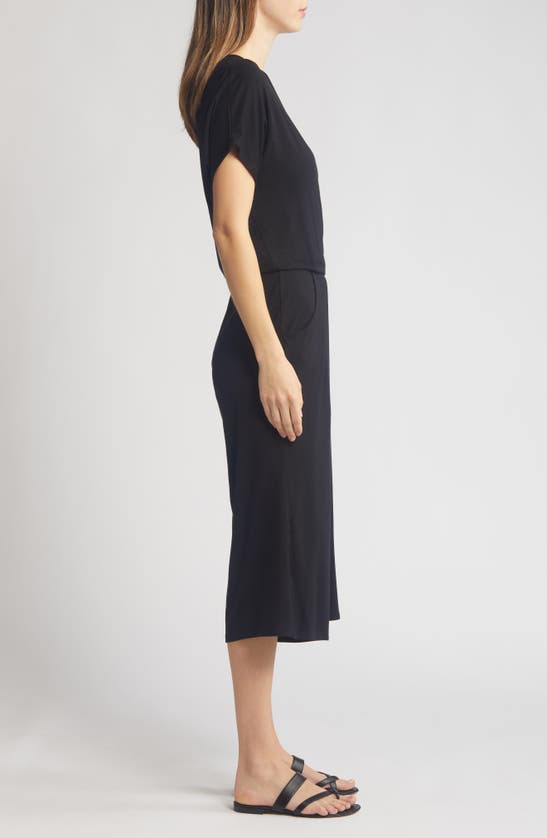 Shop Loveappella Short Sleeve Wrap Front Crop Jumpsuit In Black