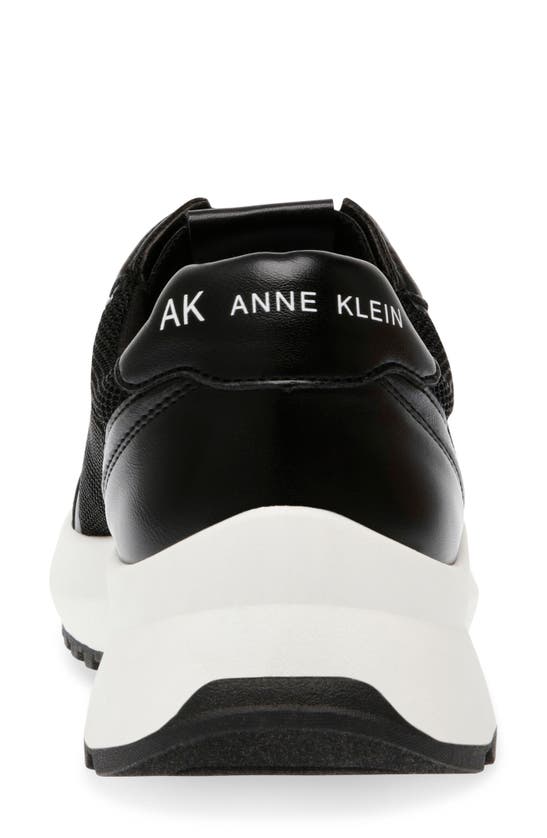 Shop Anne Klein Farida Knit Sneaker In Black