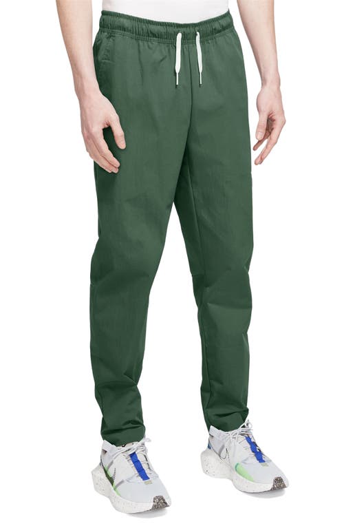 Shop Nike Woven Tapered Leg Pants In Fir/white