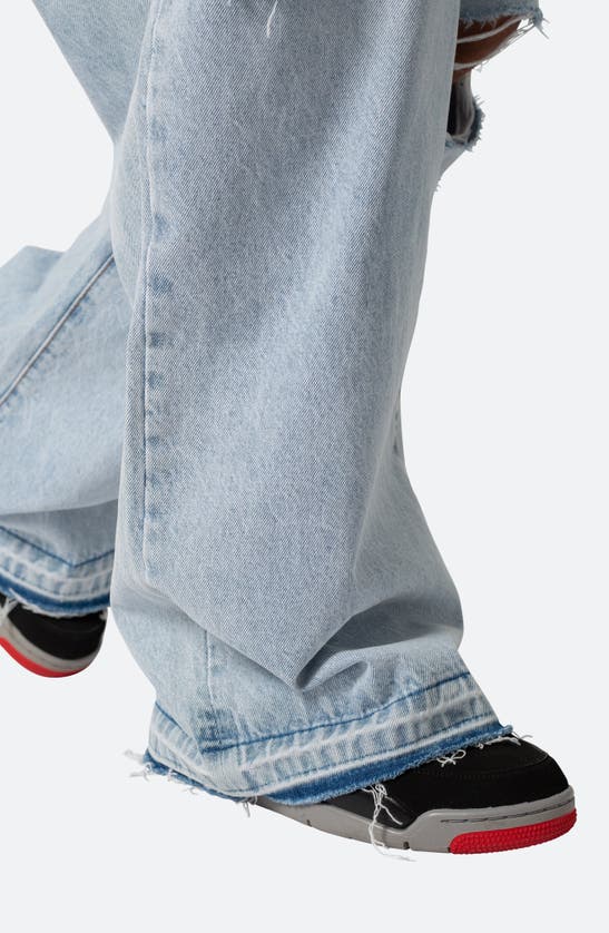 Shop Mnml Baggy Rave Ripped Wide Leg Jeans In Light Blue