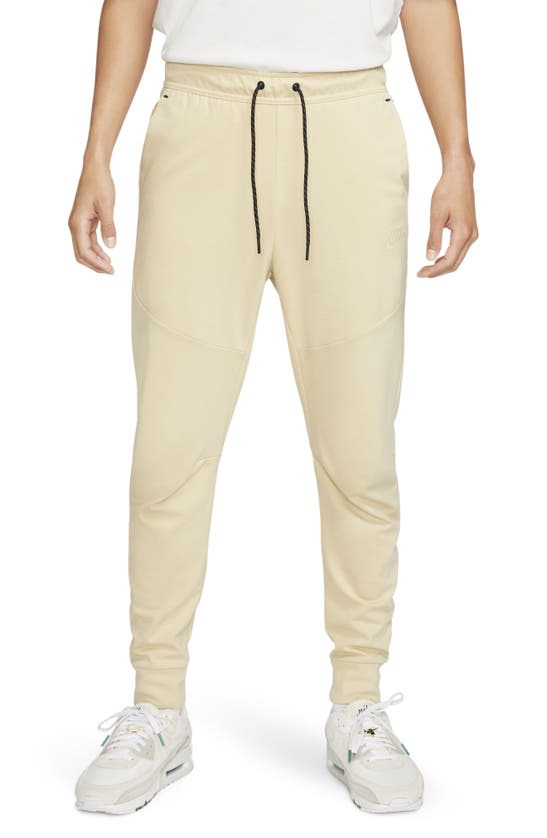Nike Tech Essentials Joggers In Team Gold/ Team Gold