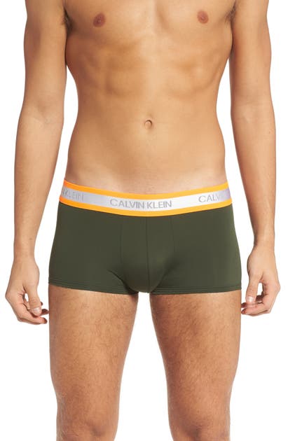 Click to view more detailed imagery on our partner's website Calvin Klein Low Rise Trunks In Duffel Bag W/ Blaze Orange Wb