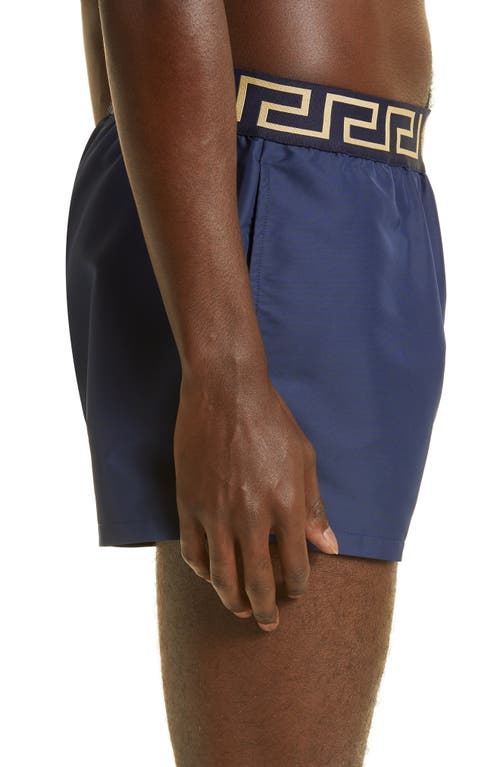 Shop Versace Greca Band Swim Trunks In Blu/gold